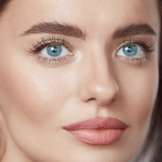 close-up-of-woman-with-clear-skin,-blue-eyes,-and-full-lips