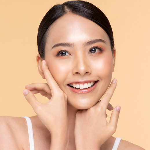 woman-showing-smooth-glowing-skin-and-touching-her-face