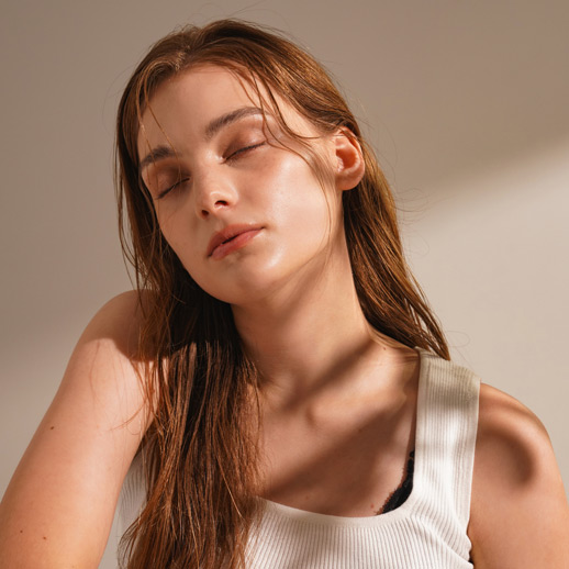 woman-with-dewy-skin-with-eyes-closed