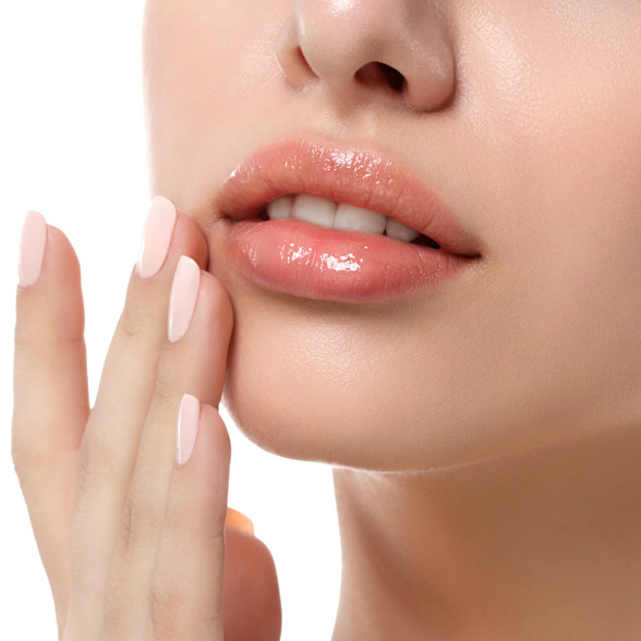 woman-with-full-lips-touching-her-face