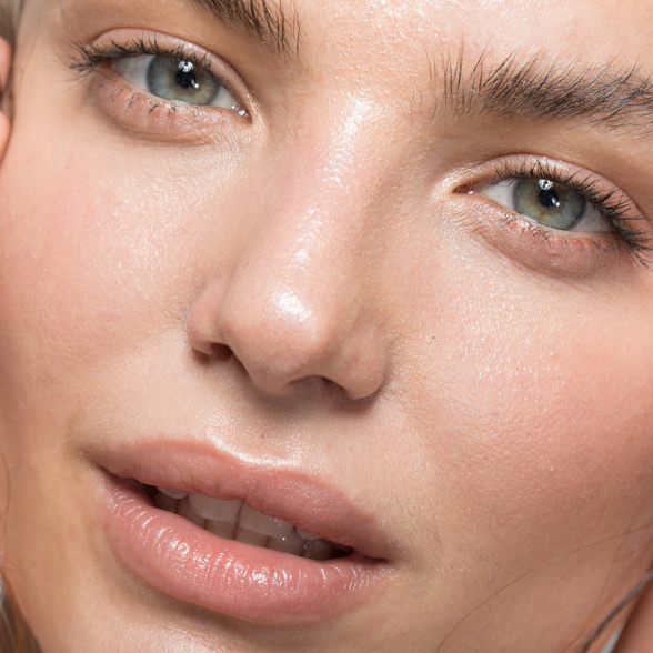 woman-with-radiant-skin-touching-her-face