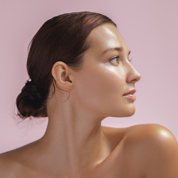 woman-with-radiant-smooth-skin-looking-sideways