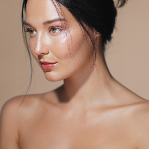 woman-with-smooth-glowing-skin-looking-to-the-side