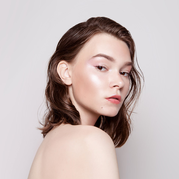 woman-with-smooth-skin-looking-over-her-shoulder