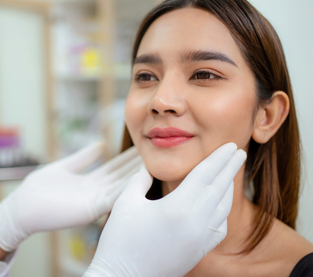 doctor-with-gloves-touching-patient's-face