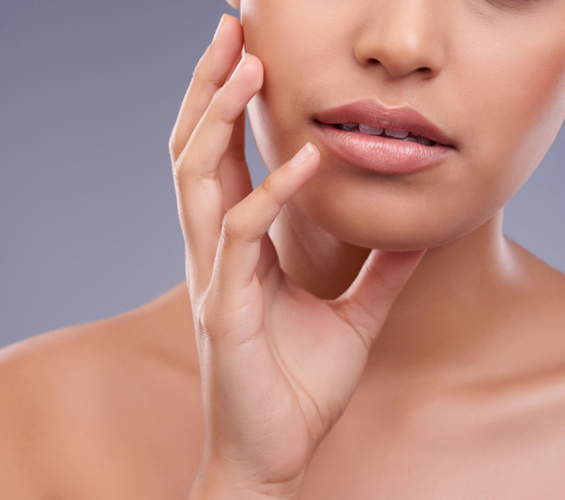 woman-with-smooth-skin-touching-face