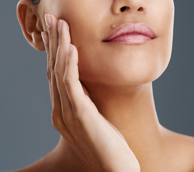 woman-with-smooth-skin-touching-face