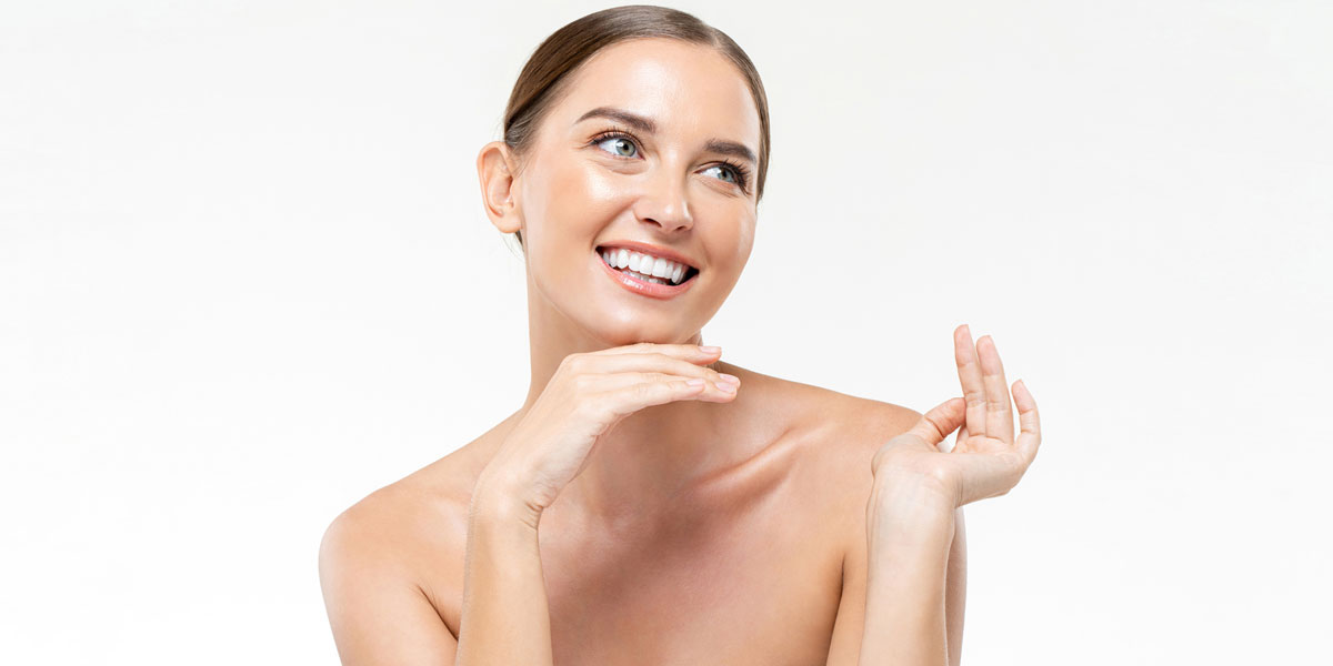 Woman smiling with bright healthy glowing skin