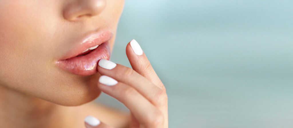 close-up-of-a-woman-touching-her-lower-lip