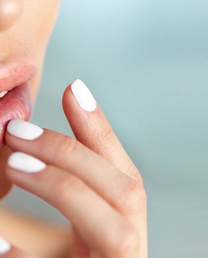 close-up-of-a-woman-touching-her-lower-lip