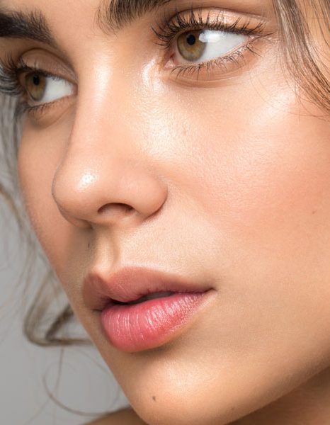 Close up of woman with smooth radiant clear skin