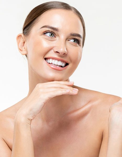 Woman smiling with bright healthy glowing skin